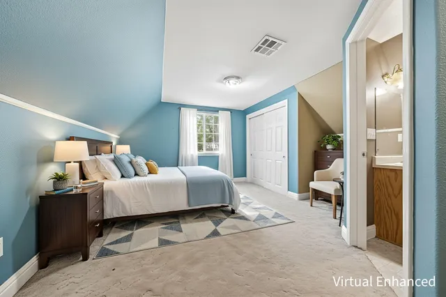 a view of an empty room and a window