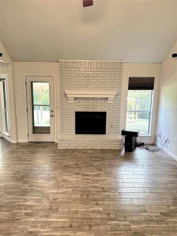 912 North Dove Road Grapevine, TX 76051 - Photo 13 of 36 a view of an empty room with a fireplace and window