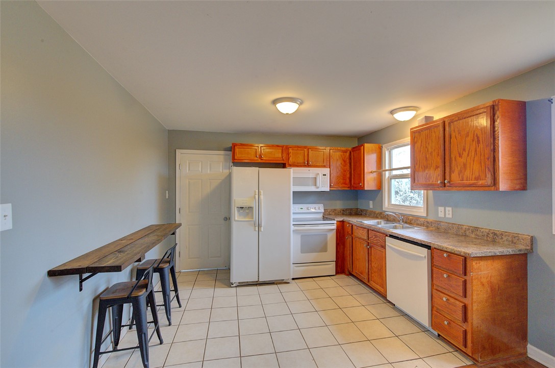 325 Rock Quarry Road Travelers Rest, SC 29690 - Photo 13 of 37 This bright kitchen features ample cabinetry, generous counter space, and a functional layout.