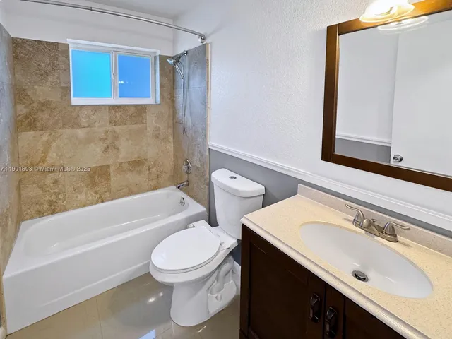 a bathroom with a sink a toilet and a bathtub