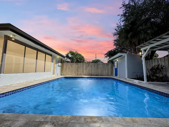 a view of backyard with green space
