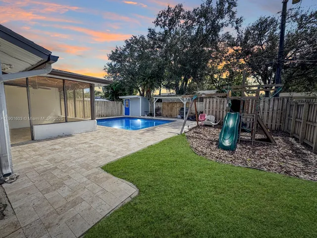a view of a backyard with a patio