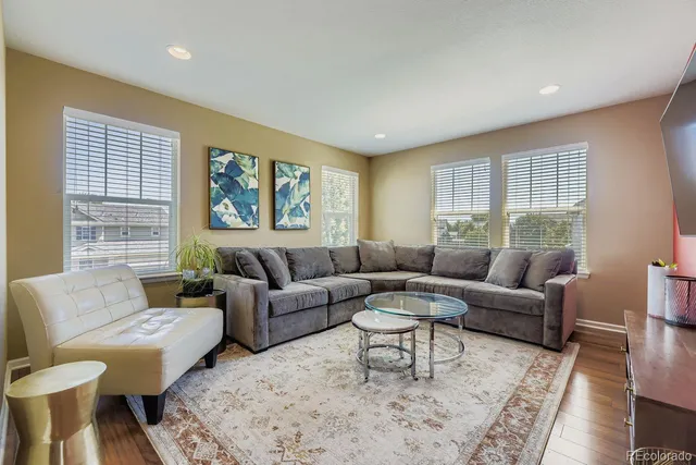 a living room with furniture and windows