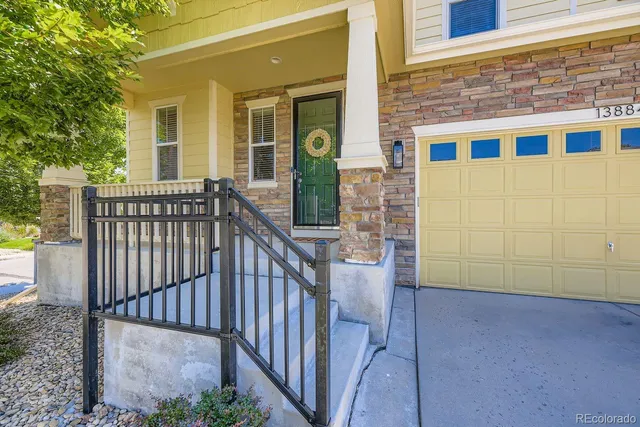 a view of a brick house with glass windows