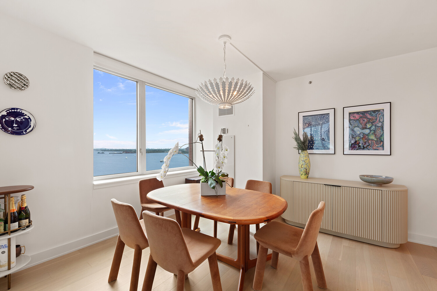 a view of a dining room with furniture window and wooden floor