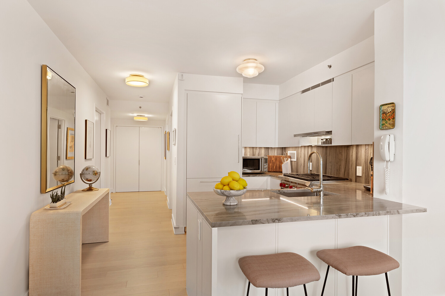 20 River Terrace, Unit 16N Manhattan, NY 10282 - Photo 3 of 9 a bathroom with a sink double vanity and shower