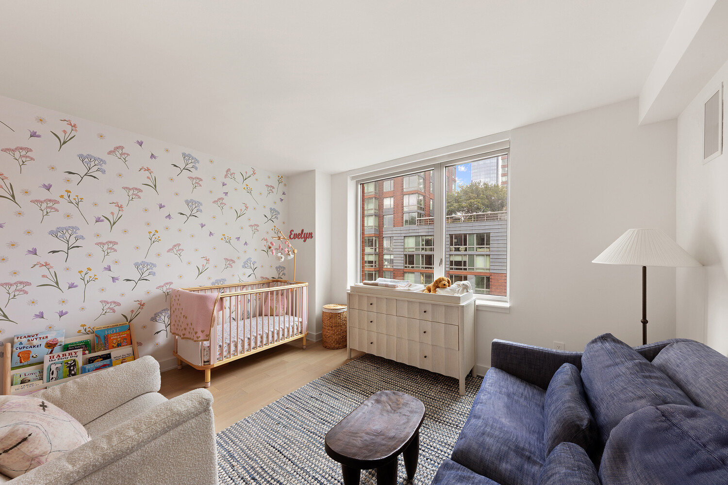 20 River Terrace, Unit 16N Manhattan, NY 10282 - Photo 7 of 9 a living room with furniture and a window