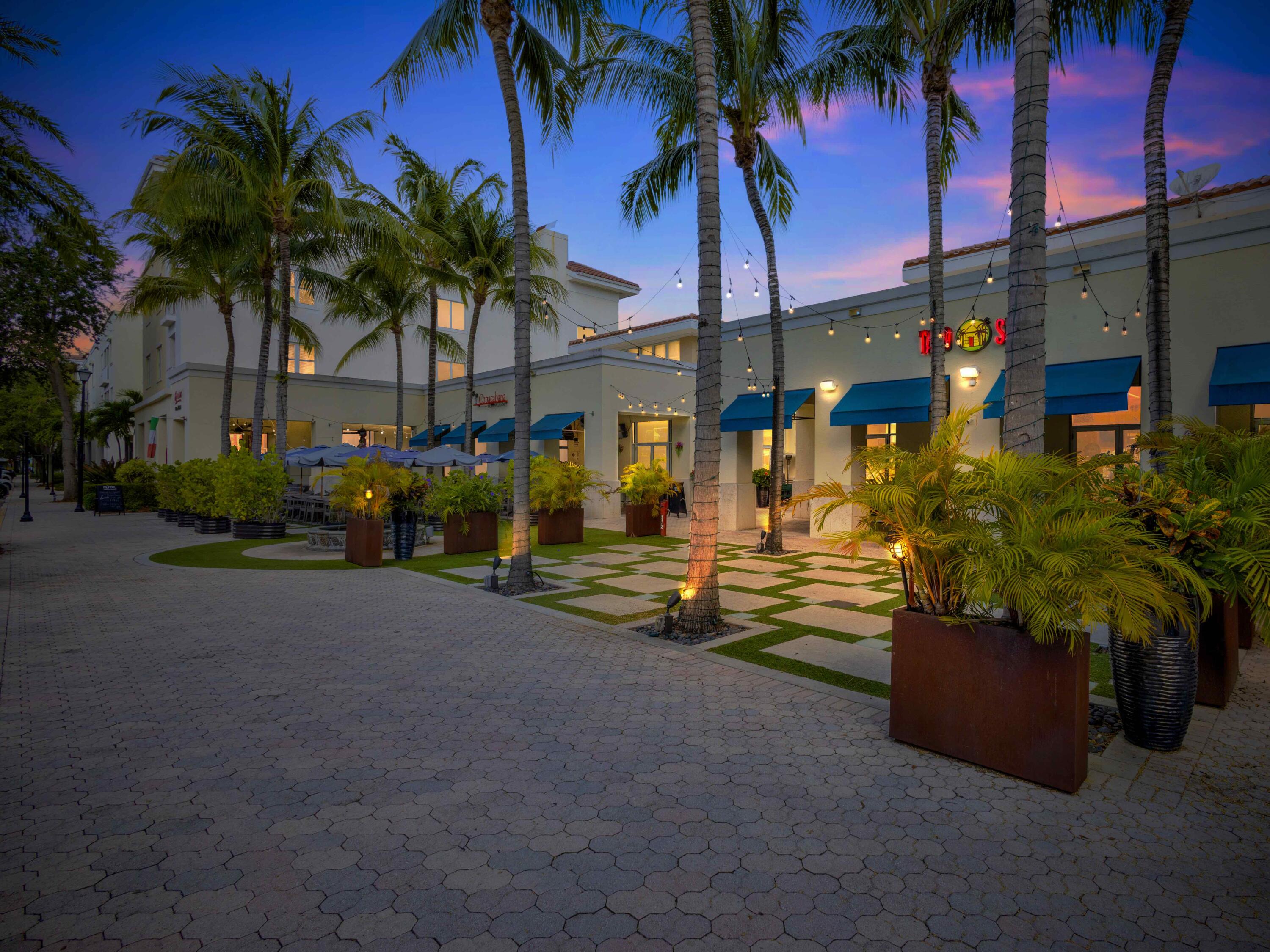 1155 Main Street, Unit 309 Jupiter, FL 33458 - Photo 2 of 35 Buildimg Dining Plaza Dusk