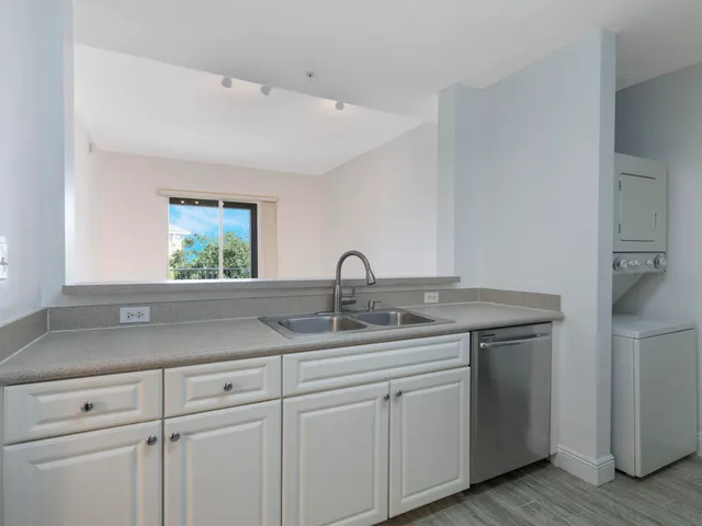 a kitchen with a sink and a window