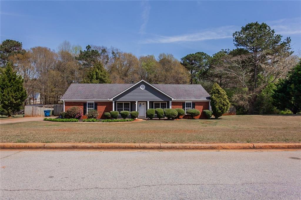 65 Springfield Drive Covington, GA 30016 - Photo 1 of 1 front view of a house with a street