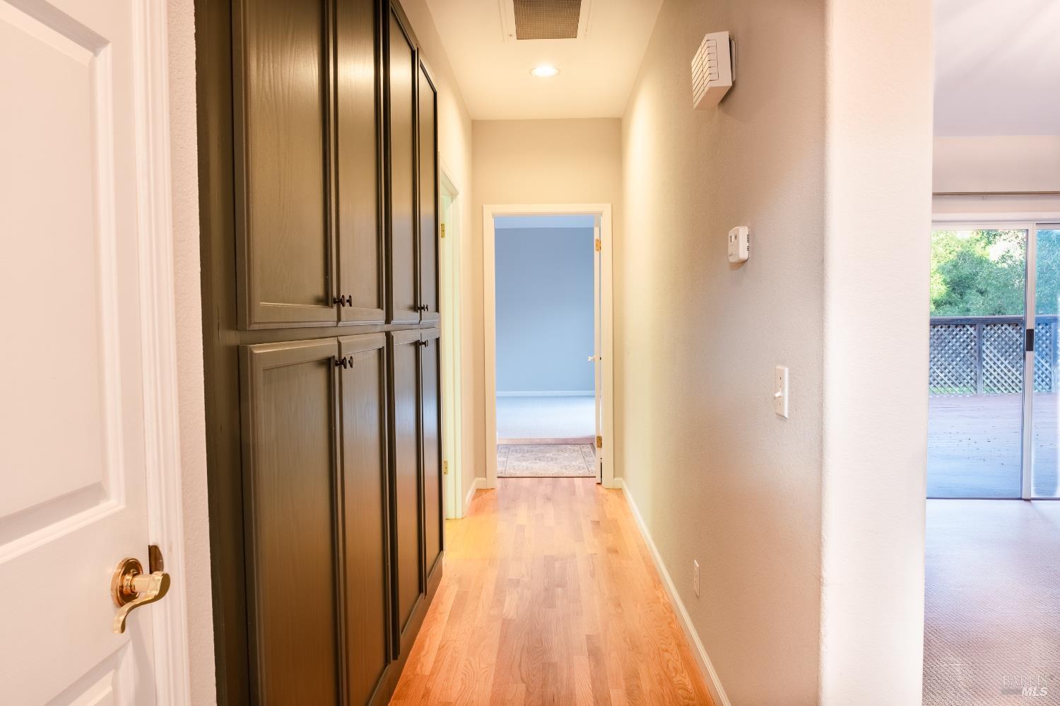 6261 Meadowstone Drive Santa Rosa, CA 95409 - Photo 13 of 21 a view of a hallway with wooden floor