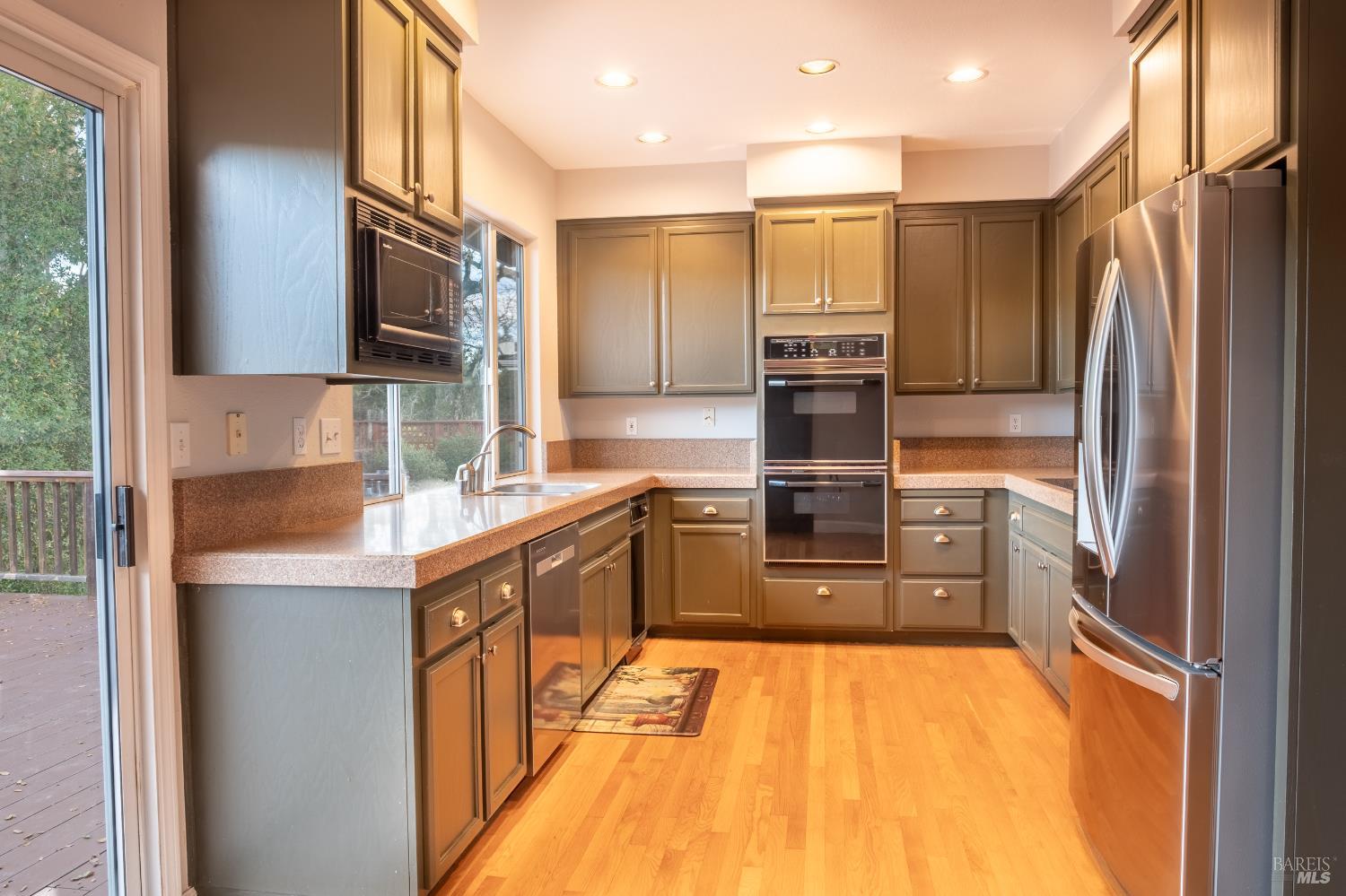 6261 Meadowstone Drive Santa Rosa, CA 95409 - Photo 16 of 21 a kitchen with stainless steel appliances granite countertop a refrigerator and a sink