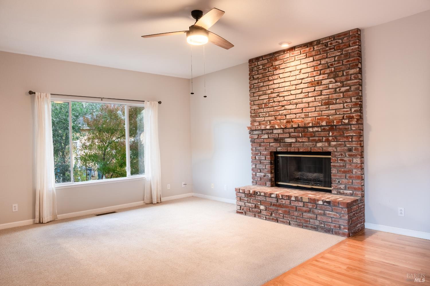 6261 Meadowstone Drive Santa Rosa, CA 95409 - Photo 17 of 21 a living room with furniture and a fireplace