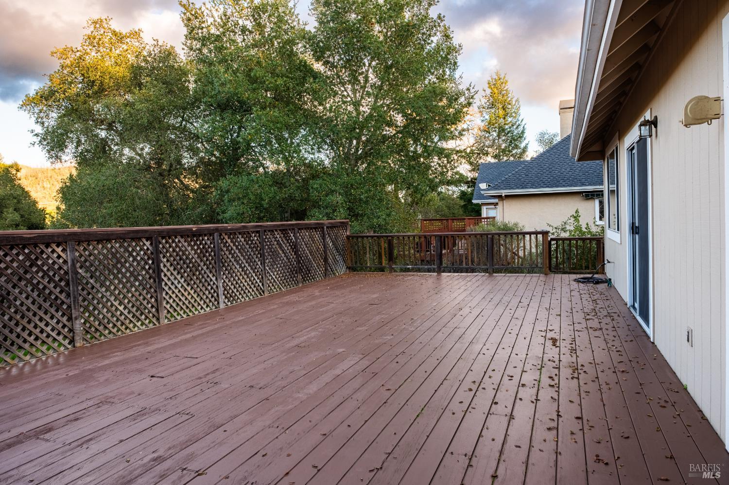 6261 Meadowstone Drive Santa Rosa, CA 95409 - Photo 4 of 21 a view of deck with wooden floor and fence