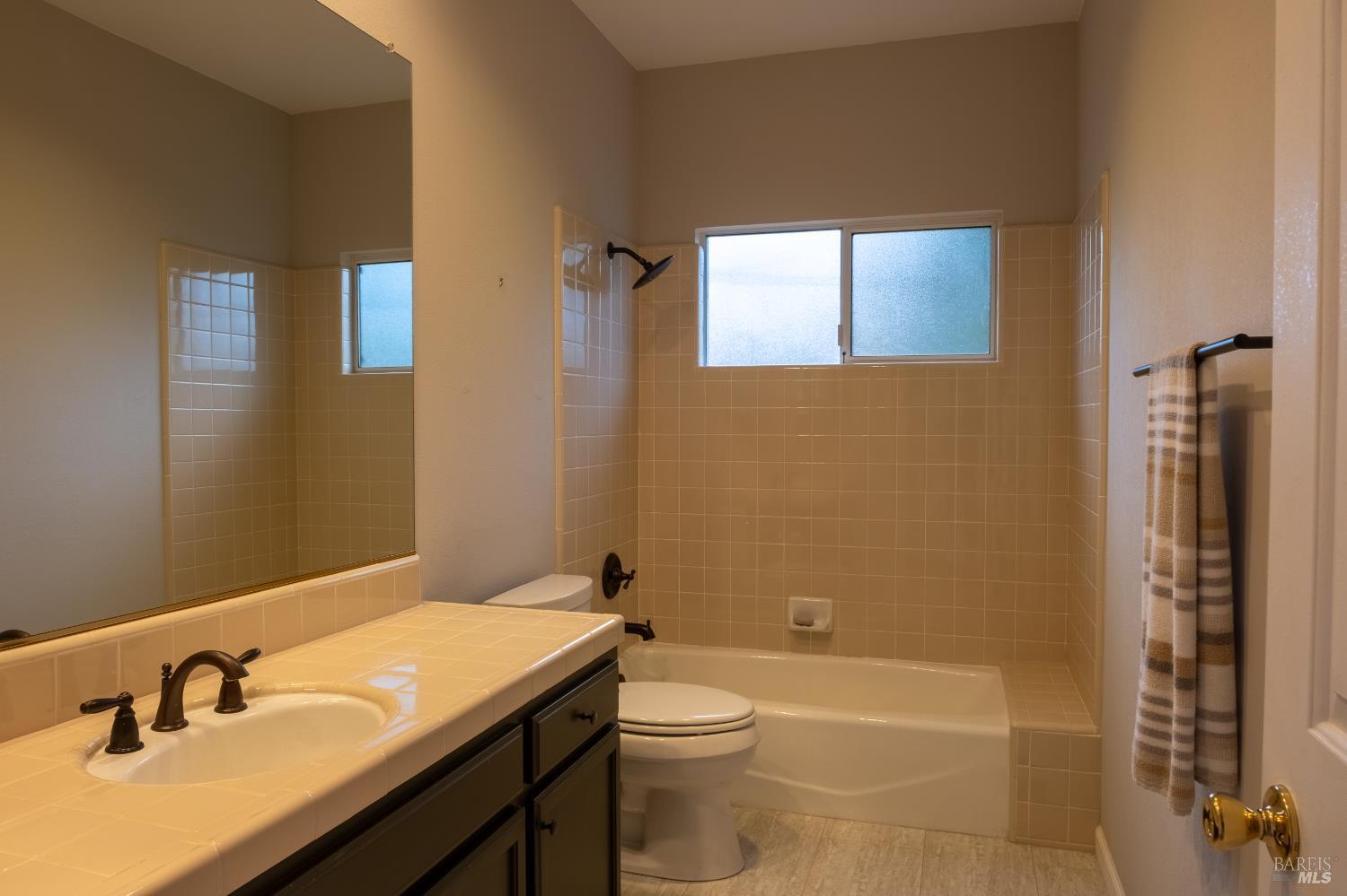 6261 Meadowstone Drive Santa Rosa, CA 95409 - Photo 10 of 21 a bathroom with a sink a toilet and shower