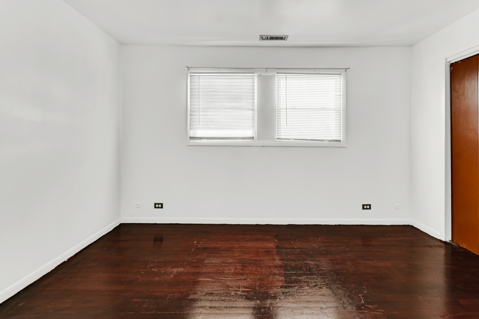 403 Prairie Avenue, Unit 1 Calumet City, IL 60409 - Photo 4 of 9 wooden floor in an empty room with a window