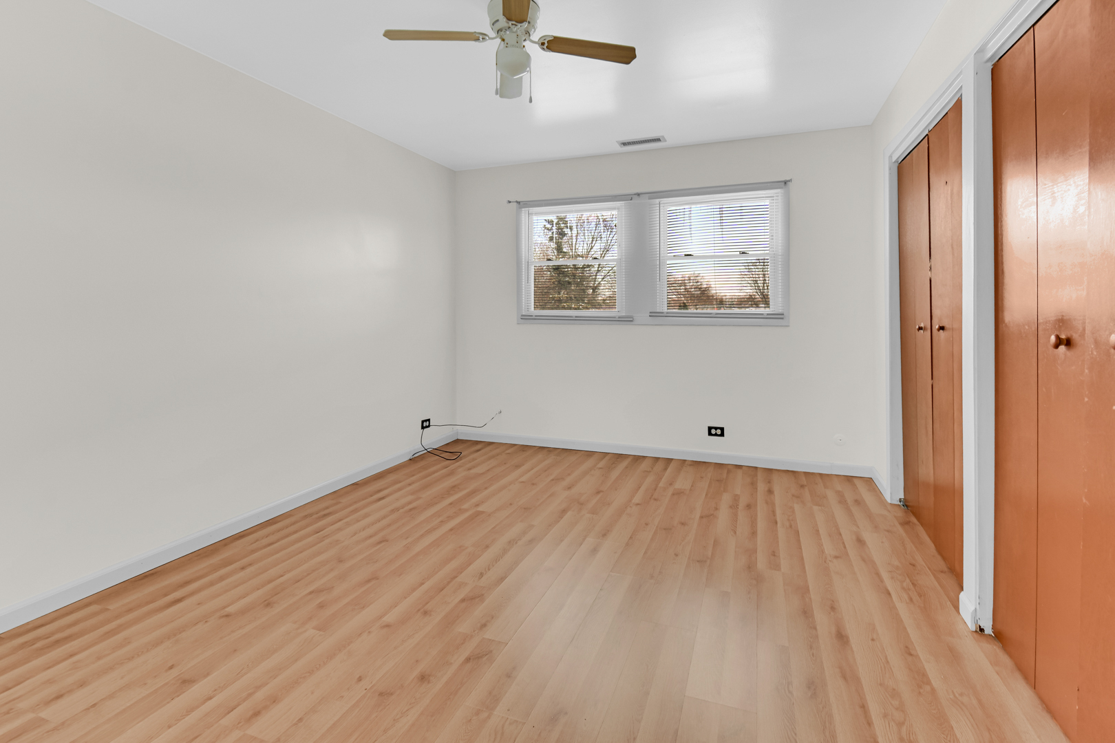 403 Prairie Avenue, Unit 1 Calumet City, IL 60409 - Photo 5 of 9 wooden floor in an empty room with a window