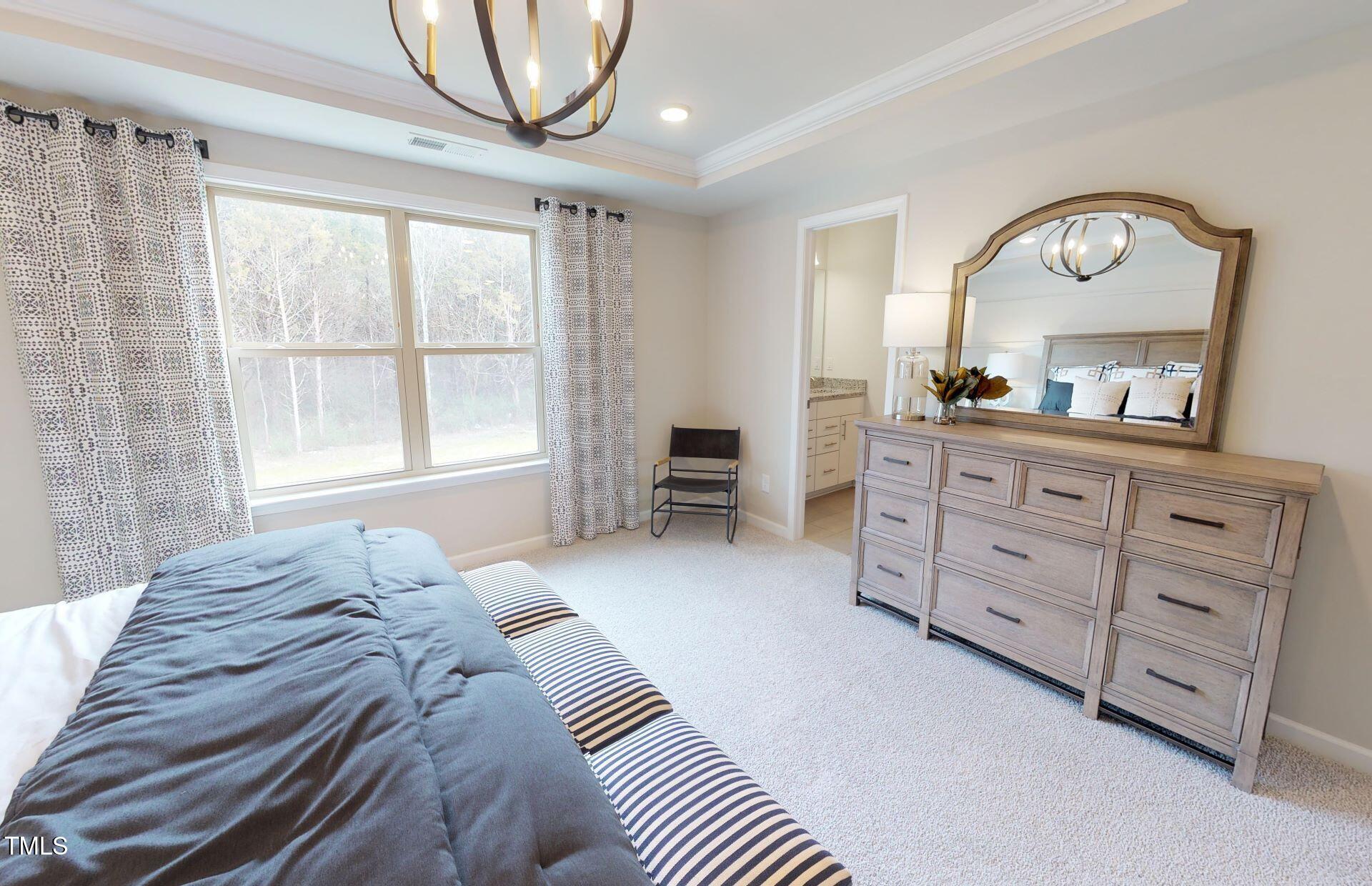 1105 Freestone Road Durham, NC 27703 - Photo 12 of 21 a bedroom with a bed and a dresser