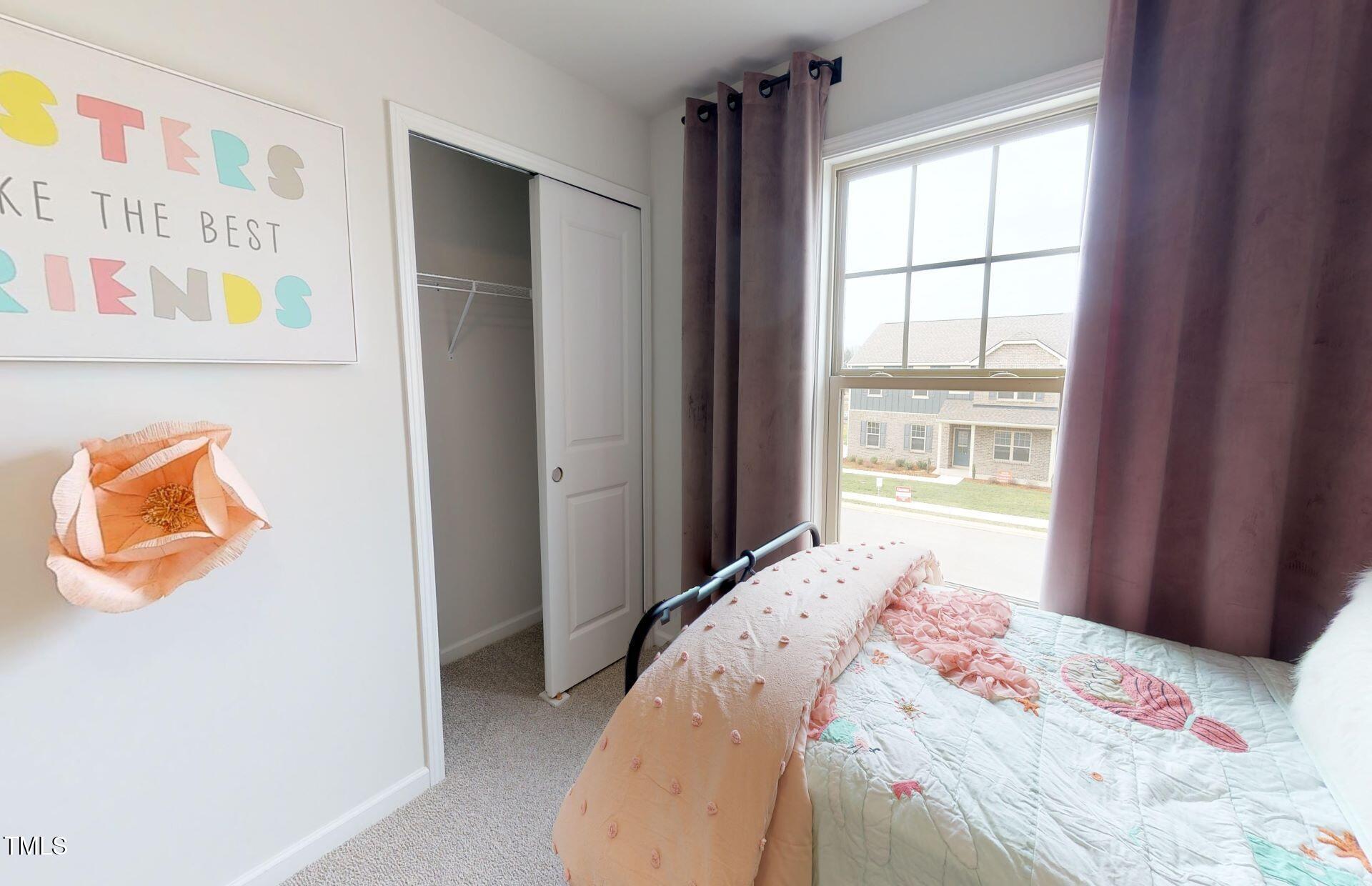 1105 Freestone Road Durham, NC 27703 - Photo 18 of 21 a bedroom with a bed and a window