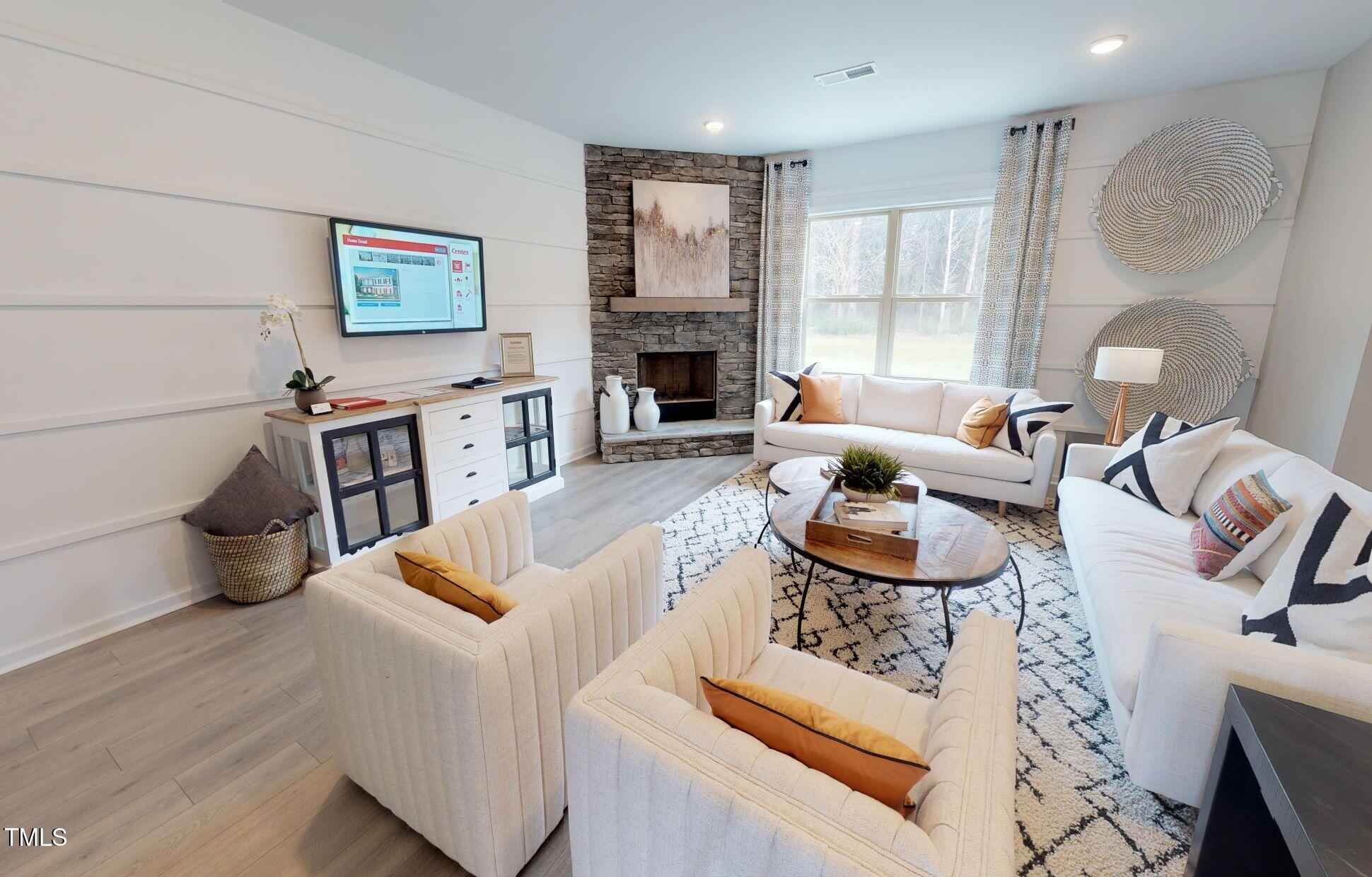 1105 Freestone Road Durham, NC 27703 - Photo 8 of 21 a living room with furniture and a fireplace