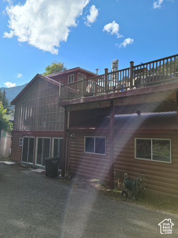97 East Main Street Stockton, UT 84071 - Photo 18 of 58 Rear view of house with sunroom and rooftop deck