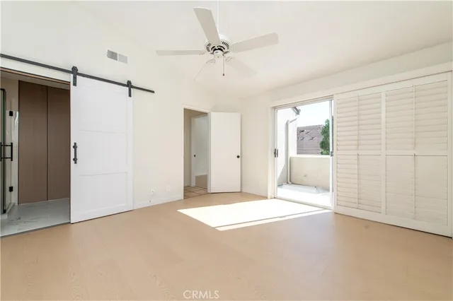 a white toilet sitting next to a bathroom