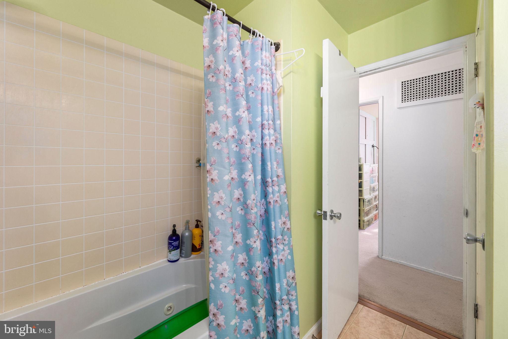 6623 Braddock Road Springfield, VA 22151 - Photo 16 of 43 a bath room with a bath tub and shower