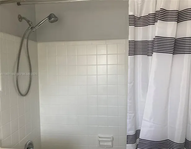 a bathroom with a sink and a shower
