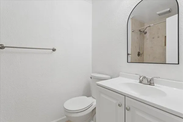 a bathroom with a sink toilet and vanity