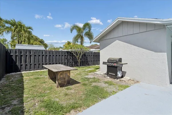 a view of a chairs and table in the patio
