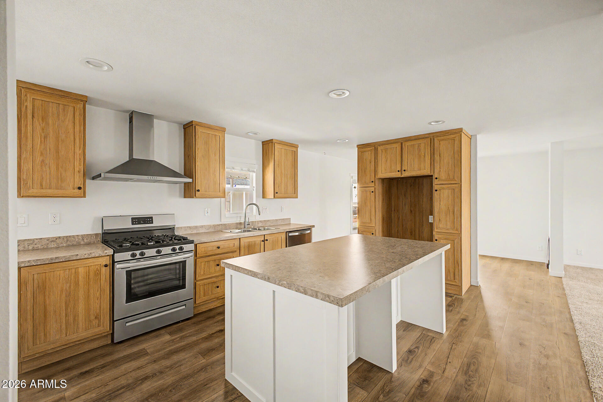 320 East McKellips Road, Unit 100 Mesa, AZ 85201 - Photo 11 of 24 a kitchen with stainless steel appliances granite countertop a stove a sink and a refrigerator