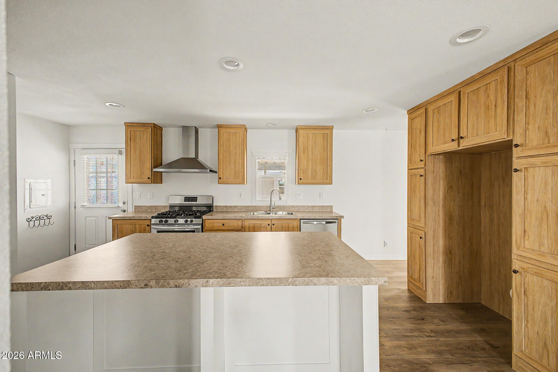320 East McKellips Road, Unit 100 Mesa, AZ 85201 - Photo 13 of 24 a kitchen with granite countertop a sink a stove and refrigerator