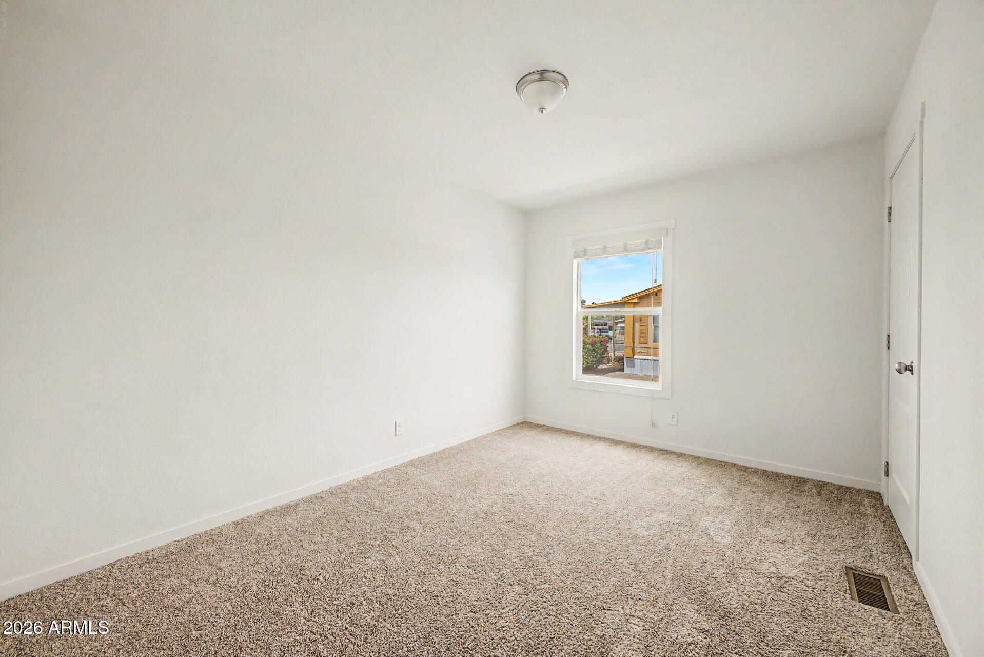 320 East McKellips Road, Unit 100 Mesa, AZ 85201 - Photo 14 of 24 a view of an empty room with a window