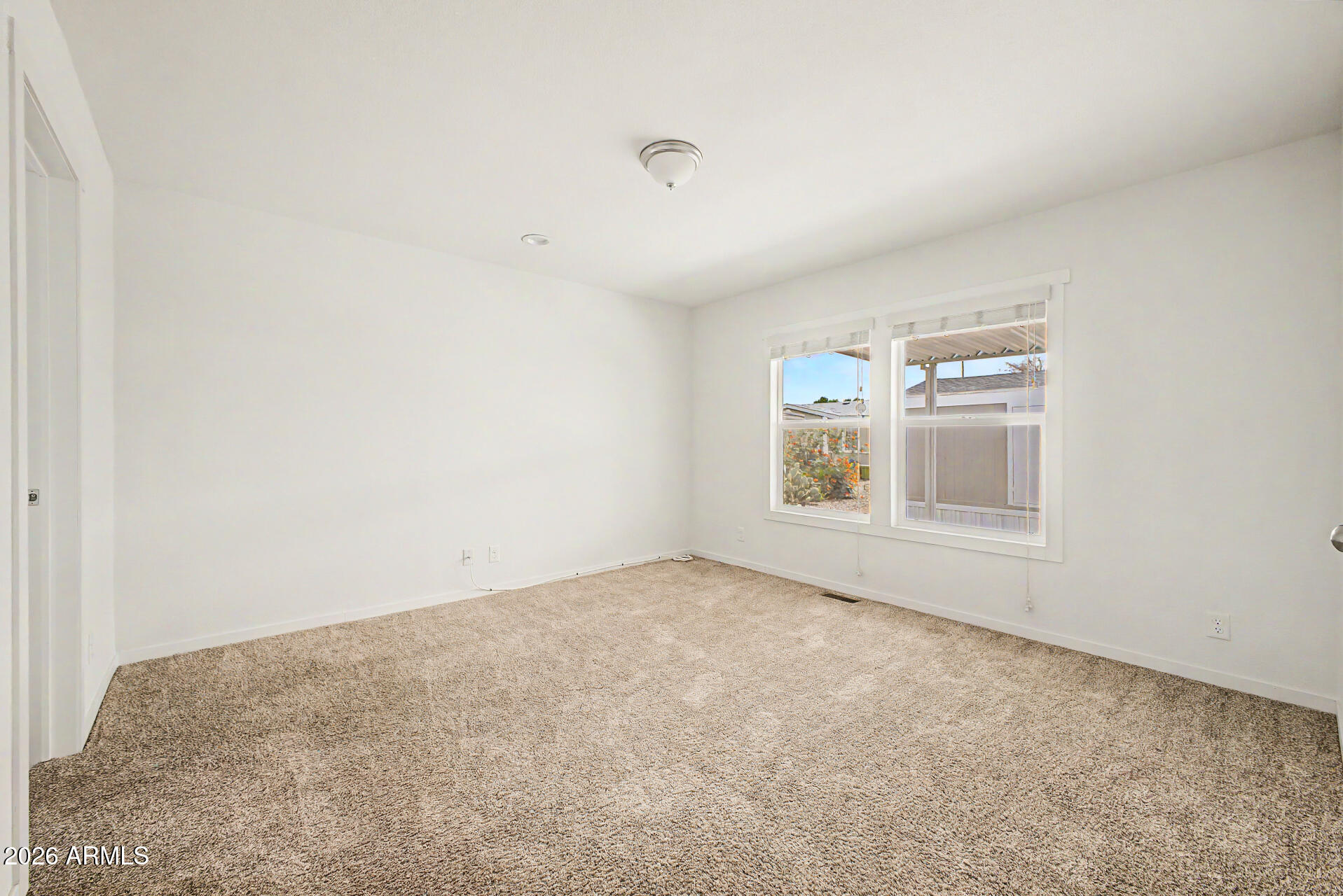 320 East McKellips Road, Unit 100 Mesa, AZ 85201 - Photo 18 of 24 an empty room with windows