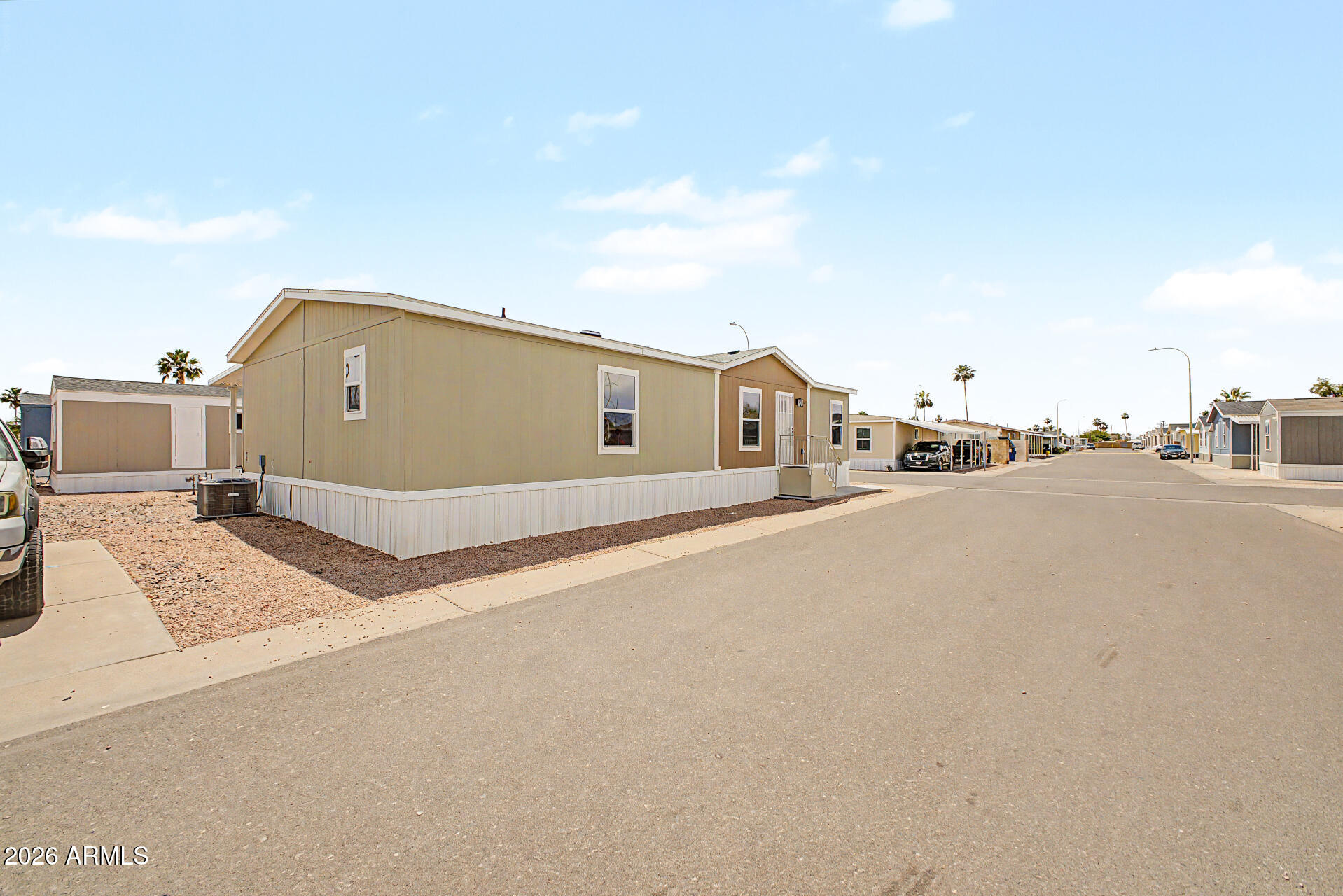 320 East McKellips Road, Unit 100 Mesa, AZ 85201 - Photo 2 of 24 a house view with a outdoor space