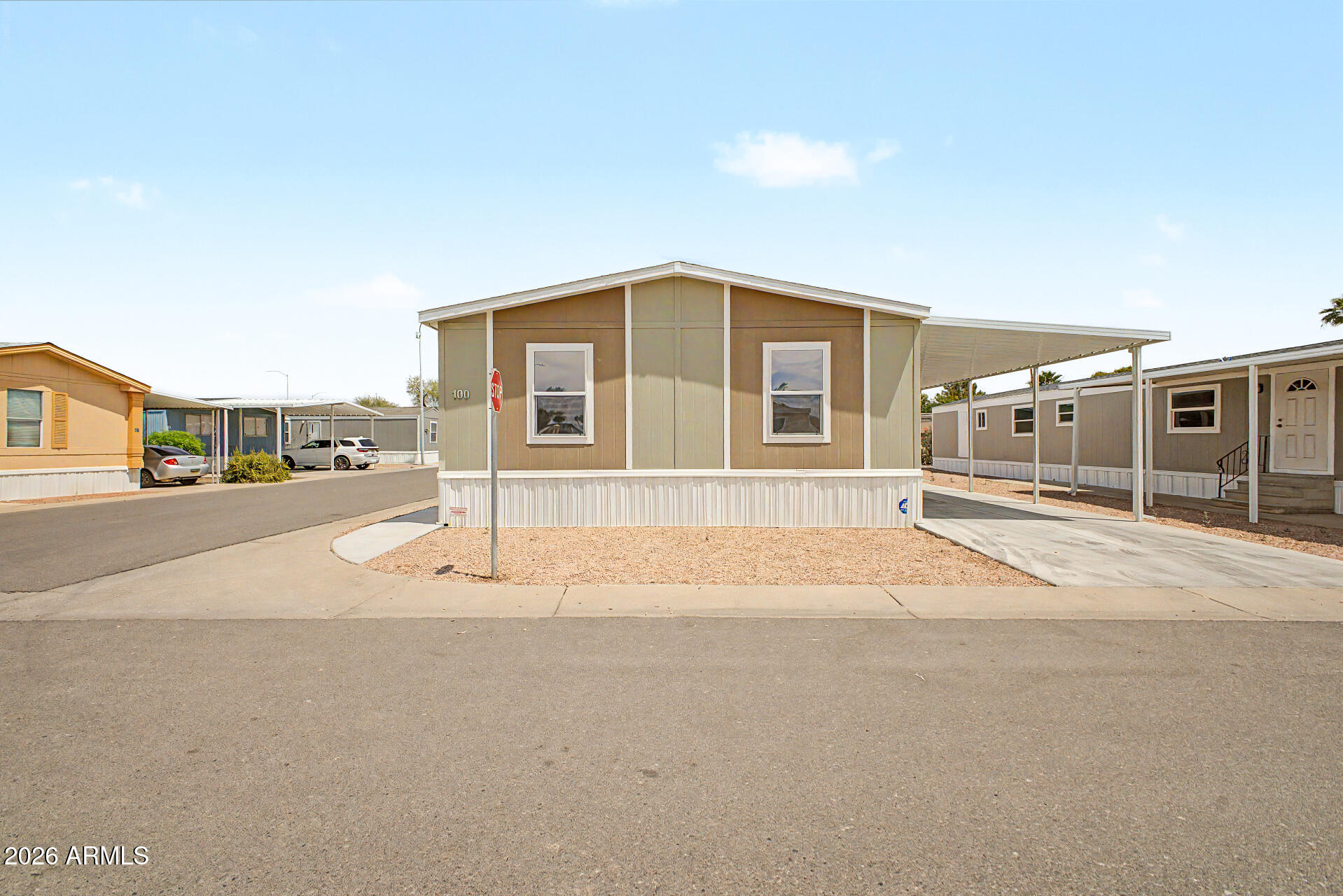 320 East McKellips Road, Unit 100 Mesa, AZ 85201 - Photo 22 of 24 a house with a outdoor space