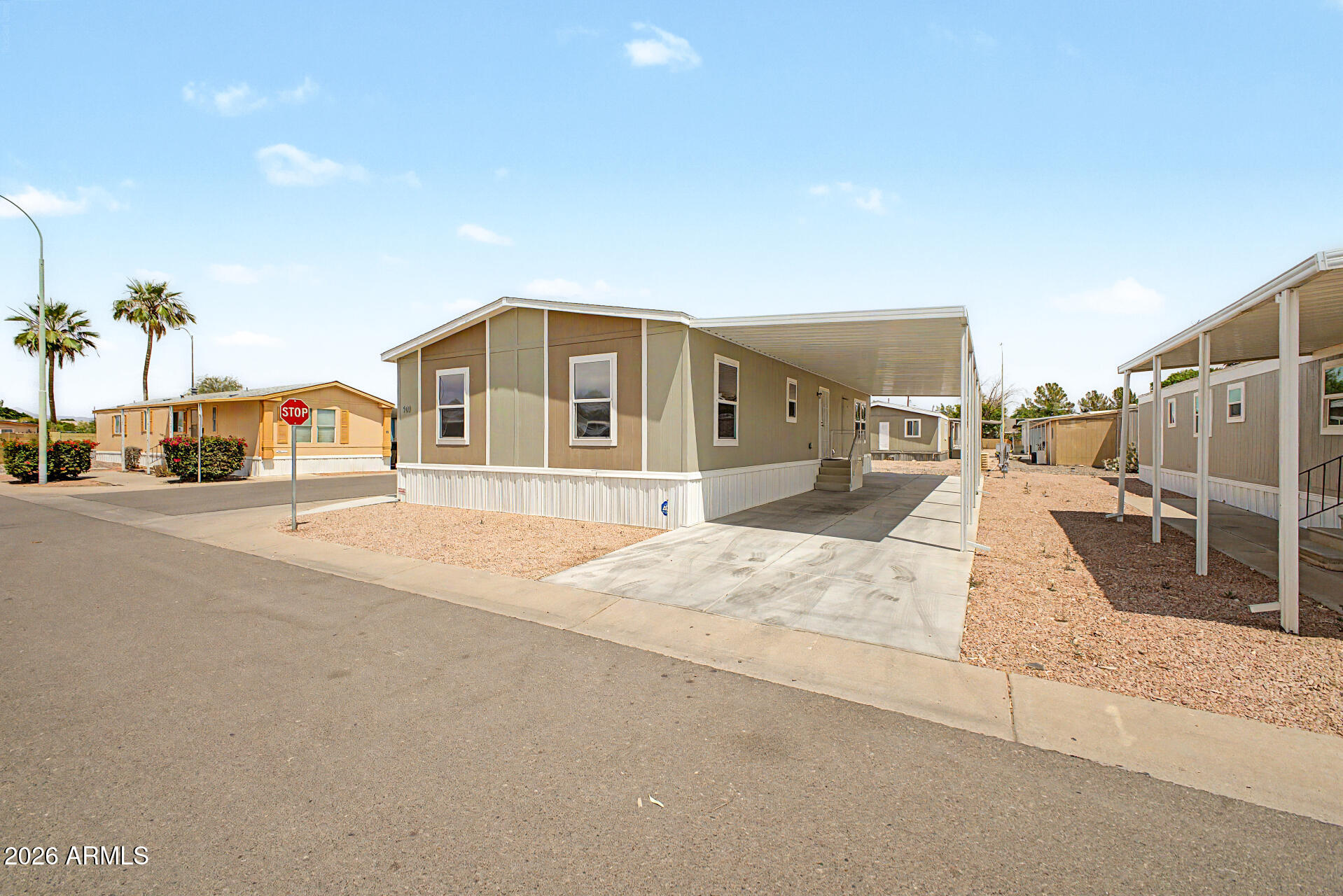 320 East McKellips Road, Unit 100 Mesa, AZ 85201 - Photo 23 of 24 a view of a house with a entertaining space
