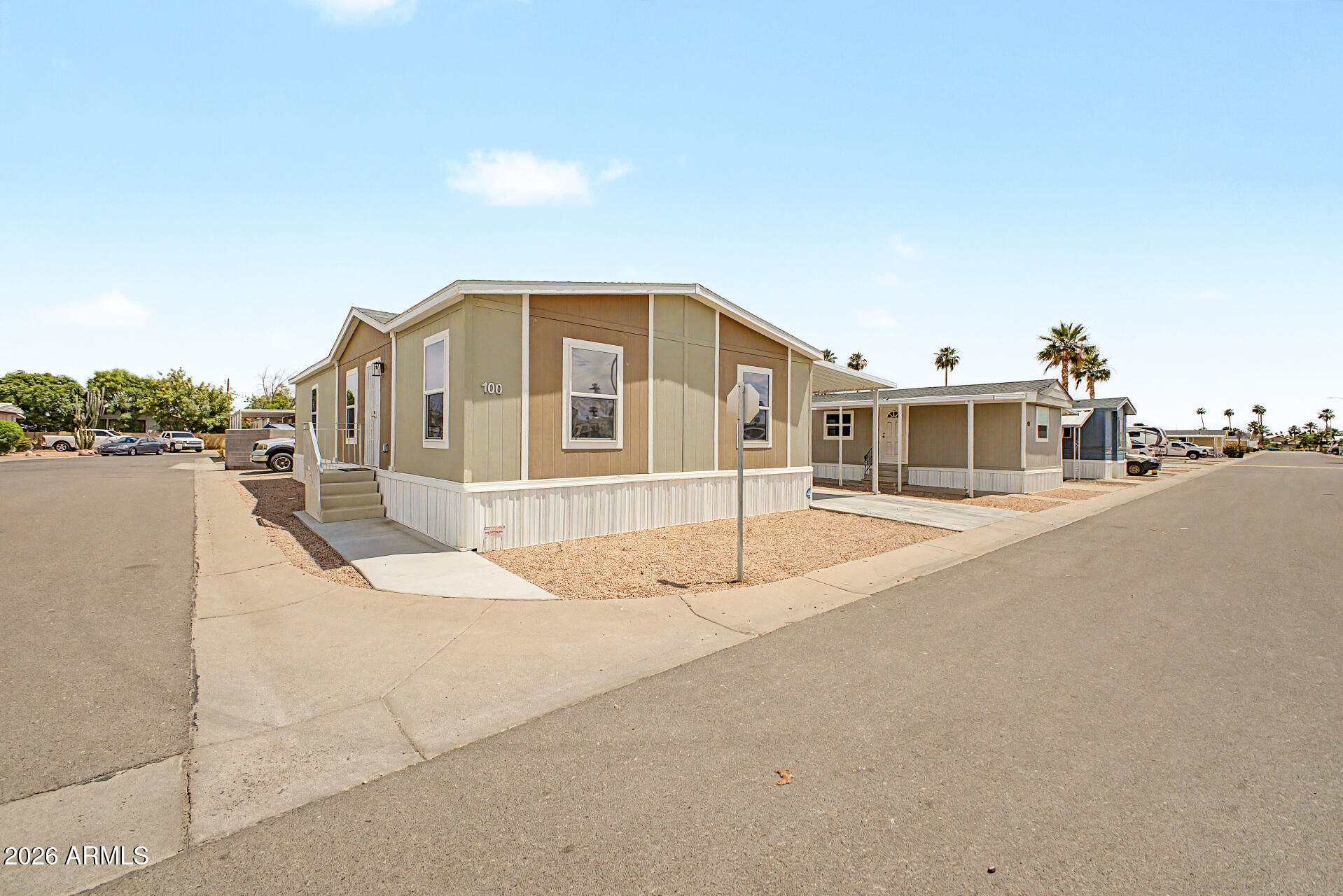 320 East McKellips Road, Unit 100 Mesa, AZ 85201 - Photo 24 of 24 a front view of a house with a yard
