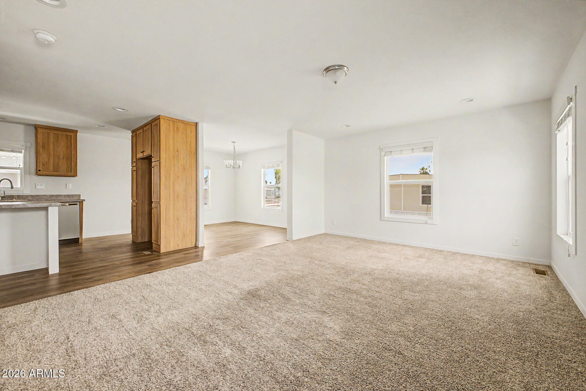 320 East McKellips Road, Unit 100 Mesa, AZ 85201 - Photo 5 of 24 a view of a livingroom with a kitchen