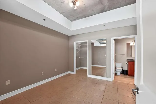 a view of an empty room with a bathroom