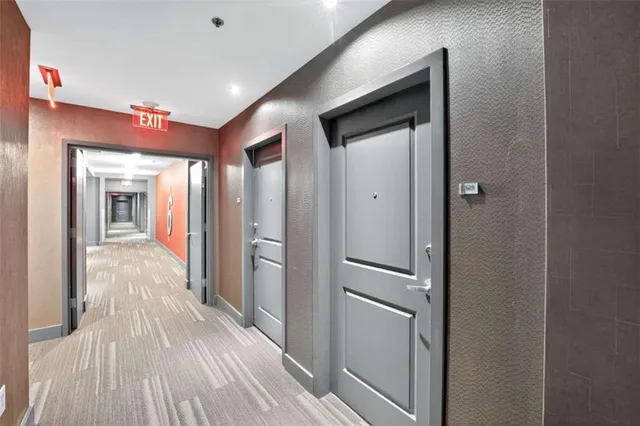a view of a patio with dining table and chairs
