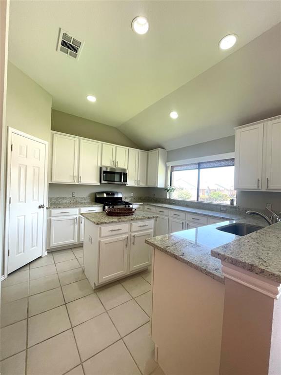 1988 Signal Ridge Place Rockwall, TX 75032 - Photo 1 of 17 Large, spacious kitchen with island