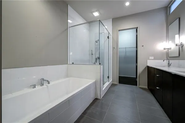 a bathroom with double sink and mirror