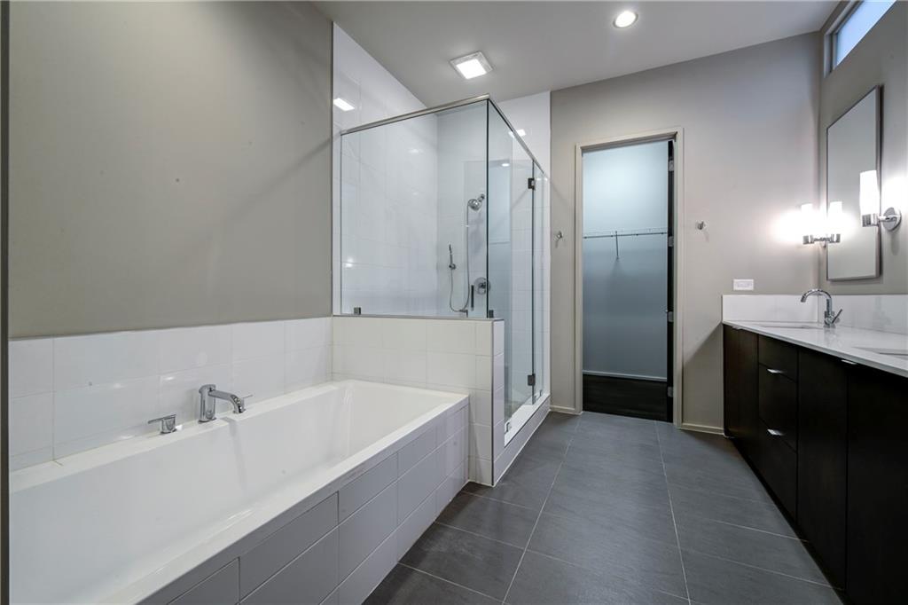 721 Longleaf Drive Northeast, Unit 8 Atlanta, GA 30342 - Photo 13 of 24 a bathroom with a tub sink and mirror
