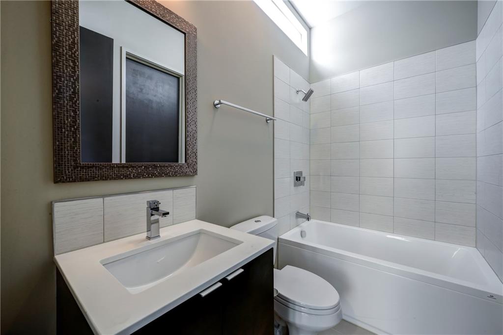 721 Longleaf Drive Northeast, Unit 8 Atlanta, GA 30342 - Photo 23 of 24 a bathroom with a sink toilet tub and shower