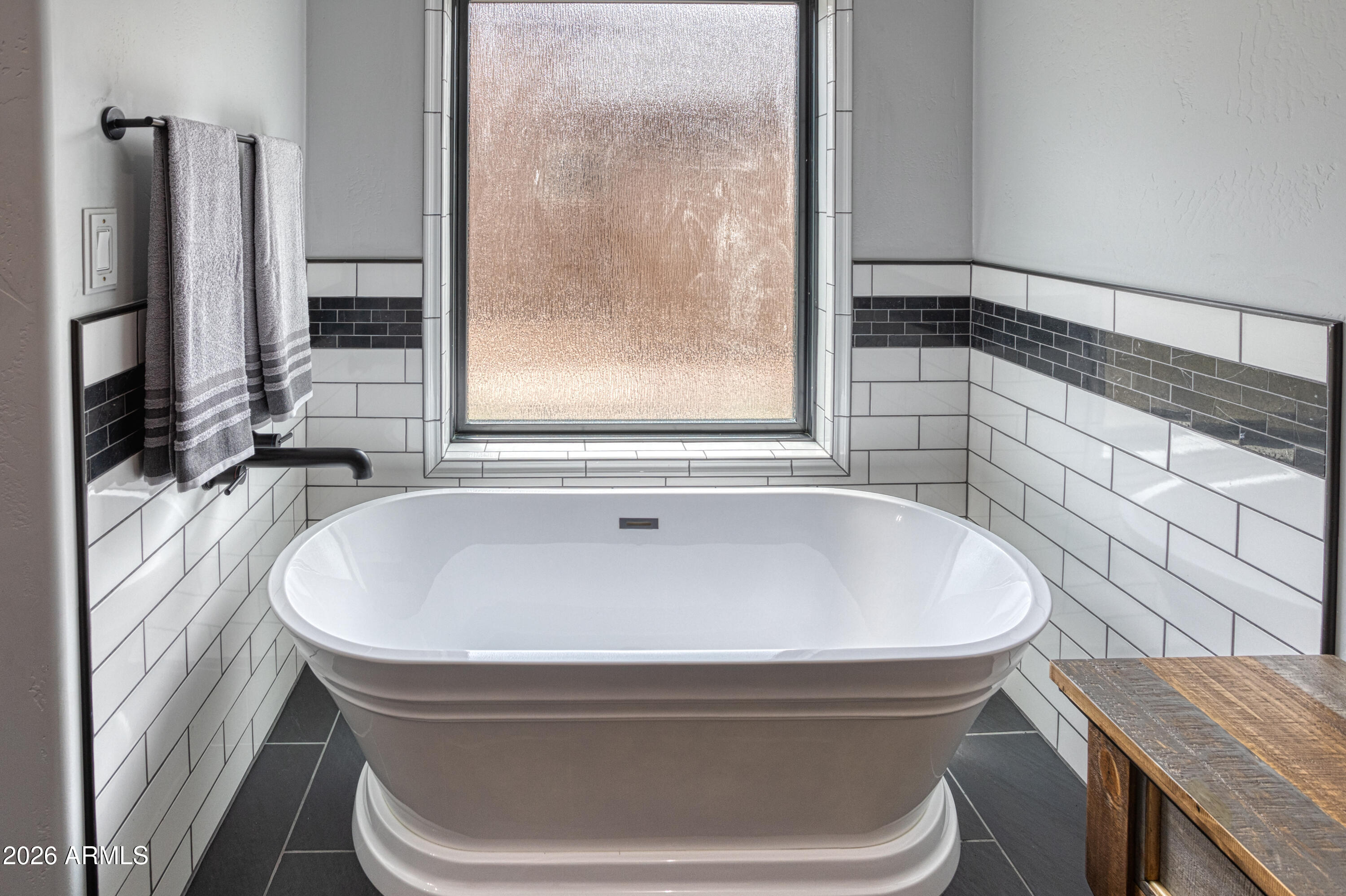 2281 West Edgewater Show Low, AZ 85901 - Photo 24 of 46 a bath tub sitting in a bathroom next to a window