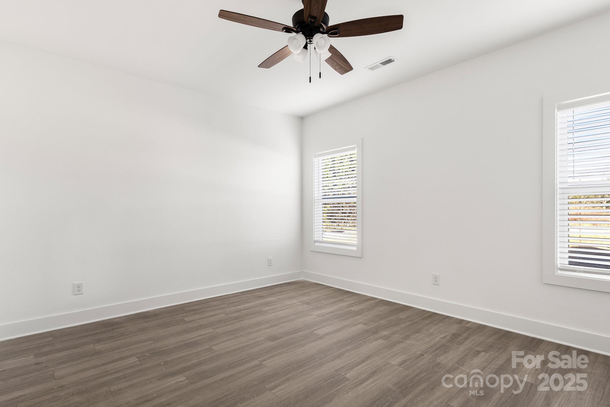 3307 Old Pageland Monroe Road Monroe, NC 28112 - Photo 14 of 35 wooden floor in an empty room with a window
