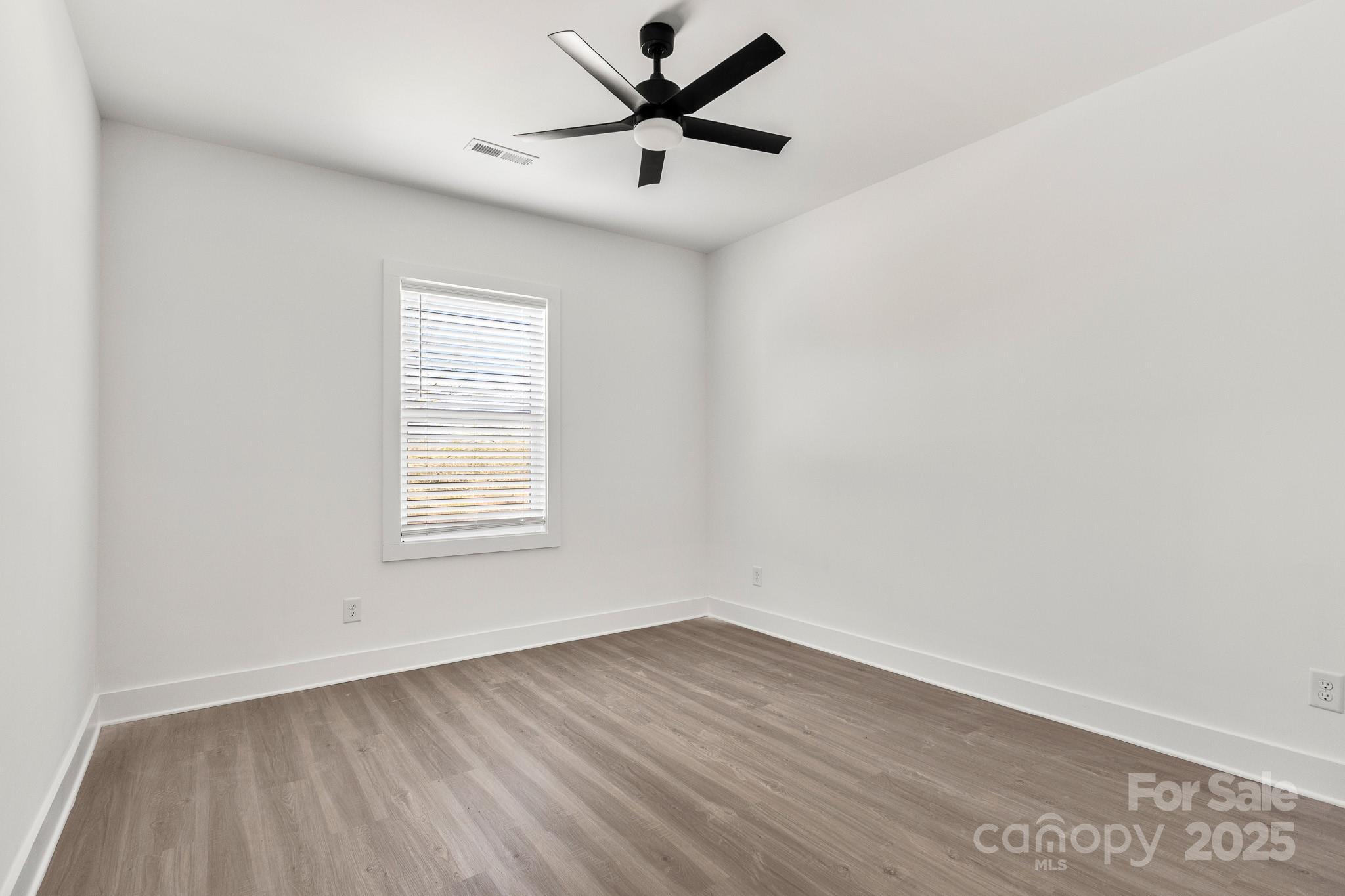 3307 Old Pageland Monroe Road Monroe, NC 28112 - Photo 22 of 35 wooden floor in an empty room with a window