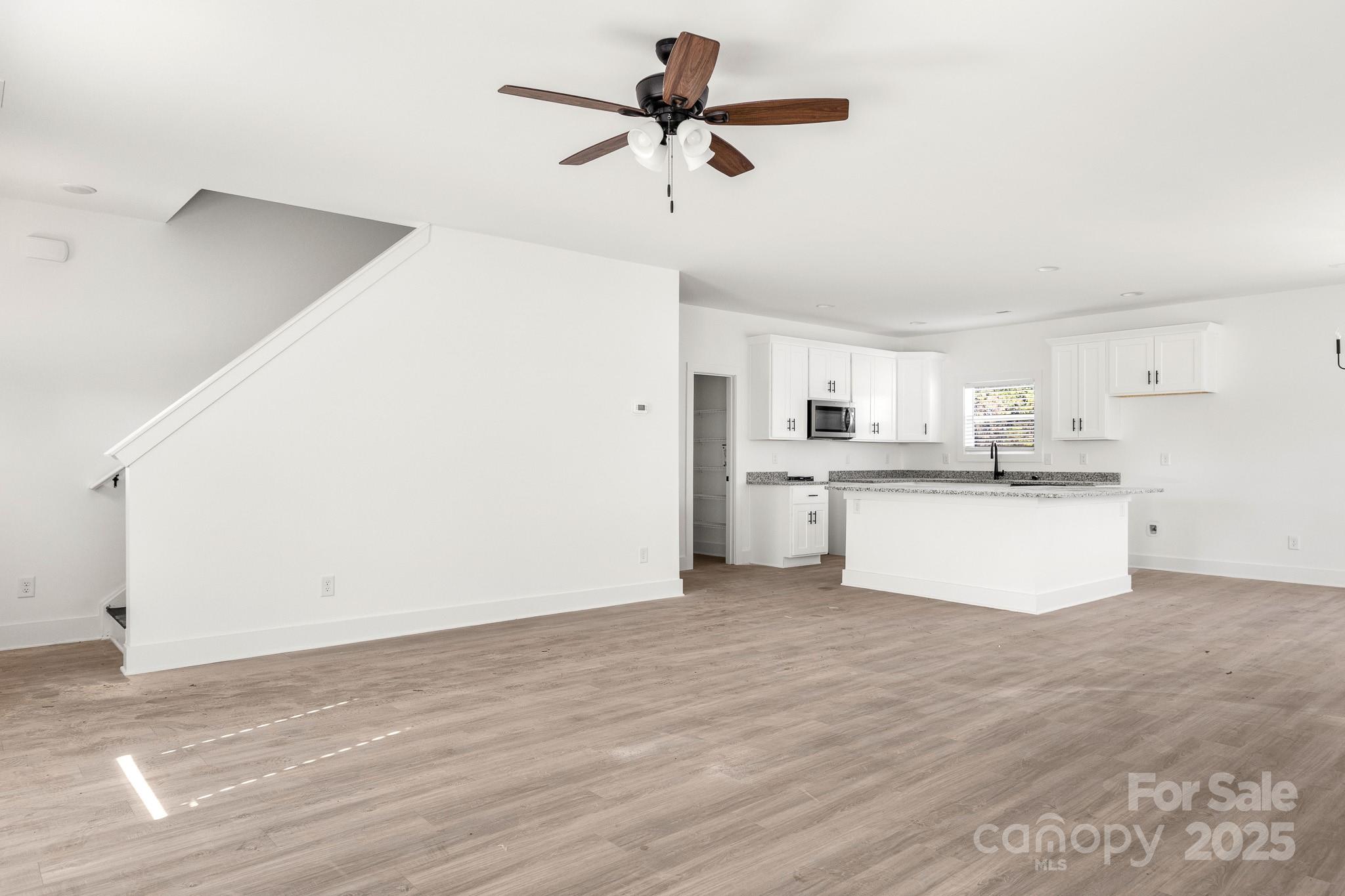3307 Old Pageland Monroe Road Monroe, NC 28112 - Photo 4 of 35 a view of kitchen with wooden floor and window