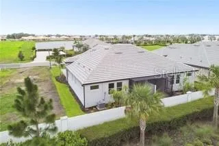 a aerial view of a house with a garden and plants